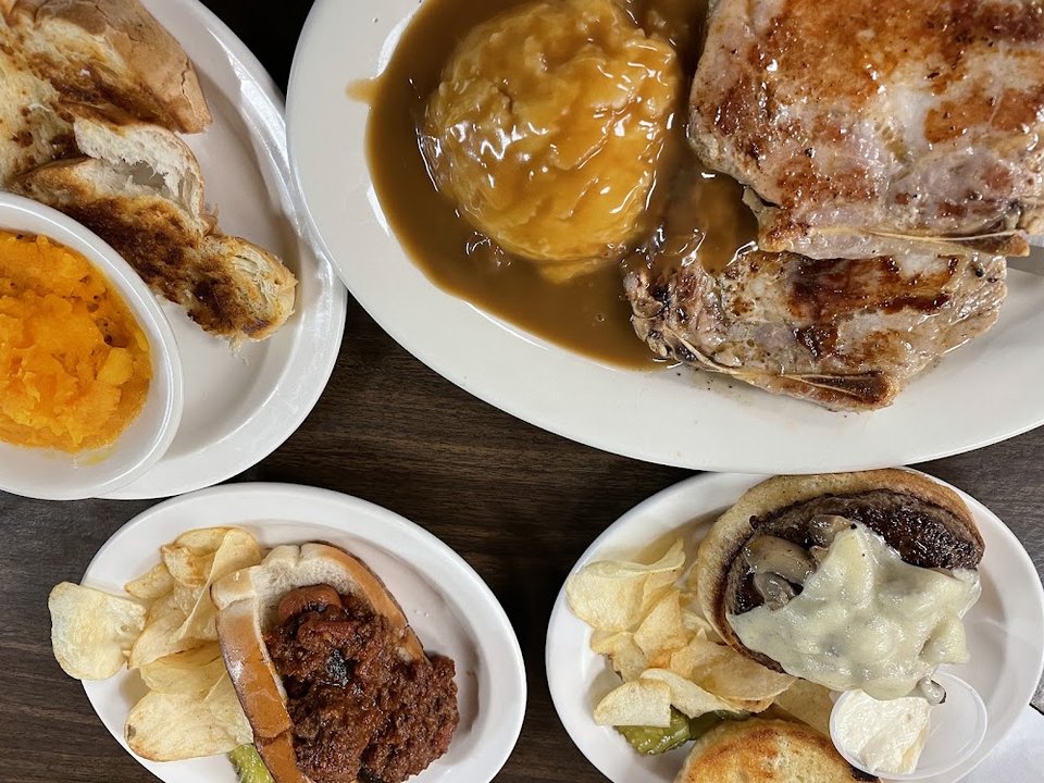 Close-up of diner menu items and categories.