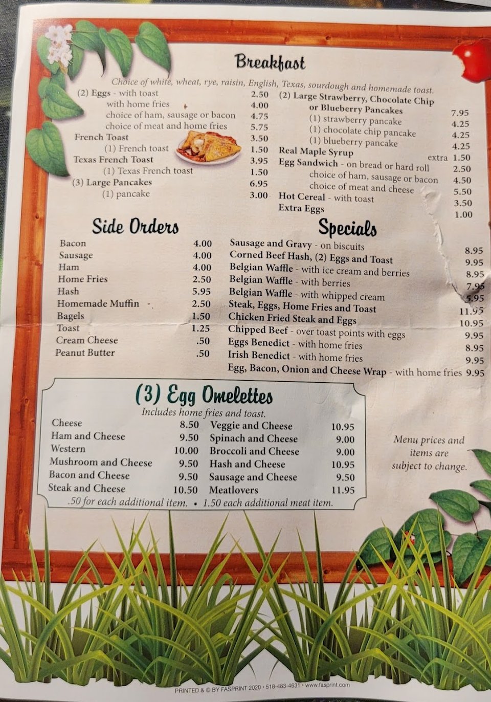 Printed menu with salads and soups.